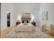 Well lit and airy bedroom, featuring a luxurious bed and ample natural light at 1521 Central St # 3C, Denver, CO 80211
