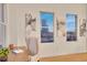 Bright home office with hardwood floors, neutral walls, and city views from the windows at 1521 Central St # 3C, Denver, CO 80211