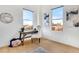 Cozy office area with hardwood floors, desk and city views from multiple windows at 1521 Central St # 3C, Denver, CO 80211