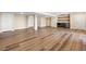 Finished basement with wood-look flooring and ample open space at 7120 Red Mesa Dr, Littleton, CO 80125