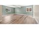 Unfinished basement with stylish flooring and natural light from two windows at 7120 Red Mesa Dr, Littleton, CO 80125