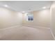 Bedroom with neutral carpeting, a small window and overhead lighting at 7120 Red Mesa Dr, Littleton, CO 80125