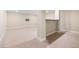 Finished basement with neutral carpet, column, and space for entertainment at 7120 Red Mesa Dr, Littleton, CO 80125