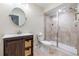 Modern bathroom featuring updated fixtures, and a tiled shower at 7120 Red Mesa Dr, Littleton, CO 80125