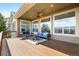 Expansive covered patio with stylish furniture and scenic backdrop at 7120 Red Mesa Dr, Littleton, CO 80125