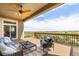 Relaxing covered patio with scenic views, and comfortable seating at 7120 Red Mesa Dr, Littleton, CO 80125