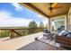 Covered patio with comfortable seating and scenic views at 7120 Red Mesa Dr, Littleton, CO 80125
