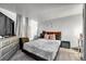 Cozy bedroom with contemporary decor, light-colored walls, and a comfortable bed at 7940 Appleblossom Ln, Westminster, CO 80030