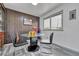 Cozy dining area with modern table, chairs, and a bright window at 7940 Appleblossom Ln, Westminster, CO 80030