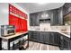 Galley kitchen with black cabinets, white countertop, and updated appliances at 7940 Appleblossom Ln, Westminster, CO 80030