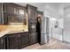 Modern kitchen featuring sleek appliances, laminate flooring, and plenty of cabinet space at 7940 Appleblossom Ln, Westminster, CO 80030
