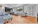 Bright living room with hardwood floors, large windows, and comfortable seating at 7940 Appleblossom Ln, Westminster, CO 80030