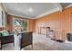 Sunroom with wicker furniture and outdoor views at 7940 Appleblossom Ln, Westminster, CO 80030