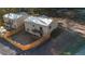 Aerial view of the back of two homes featuring fenced yards and small balconies at 91 Greeley Blvd, Palmer Lake, CO 80133