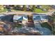 Aerial view of two single-story homes with well-maintained lawns and a shared fence at 91 Greeley Blvd, Palmer Lake, CO 80133