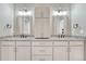 Bathroom with double sinks, granite countertops and updated hardware at 91 Greeley Blvd, Palmer Lake, CO 80133