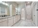 Modern bathroom with double vanity, granite countertop, and walk-in shower at 91 Greeley Blvd, Palmer Lake, CO 80133