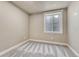 Cozy bedroom with neutral walls, plush carpeting, and a window offering natural light at 91 Greeley Blvd, Palmer Lake, CO 80133