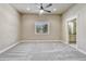 Spacious bedroom with neutral tones, large window, and plush carpeting at 91 Greeley Blvd, Palmer Lake, CO 80133