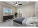 Comfortable bedroom featuring a dresser, carpet flooring, and natural light at 91 Greeley Blvd, Palmer Lake, CO 80133
