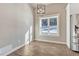 Dining area with modern light fixture and view of the snow covered property at 91 Greeley Blvd, Palmer Lake, CO 80133