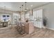 Beautiful kitchen with stainless steel appliances, large island and hardwood floors at 91 Greeley Blvd, Palmer Lake, CO 80133