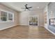 Spacious living room with fireplace, large windows, and a sliding glass door at 91 Greeley Blvd, Palmer Lake, CO 80133
