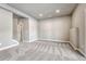Spacious living area features gray carpeting and bright recessed lighting at 91 Greeley Blvd, Palmer Lake, CO 80133