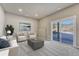 Neutral living room featuring recessed lighting, a sliding glass door, and staged furniture at 91 Greeley Blvd, Palmer Lake, CO 80133