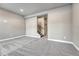 Living room with gray carpeting and view of the home's staircase at 91 Greeley Blvd, Palmer Lake, CO 80133