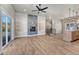 Open living room with wood floors, fireplace, and access to the kitchen at 91 Greeley Blvd, Palmer Lake, CO 80133