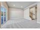 Living room with gray carpeting and sliding glass doors to the exterior at 91 Greeley Blvd, Palmer Lake, CO 80133