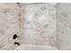 The shower showcases elegant marble-style tiling and modern black fixtures at 91 Greeley Blvd, Palmer Lake, CO 80133