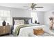 Comfortable bedroom with ceiling fan, neutral decor, and ample natural light creating a peaceful retreat at 7154 S Hudson Cir, Centennial, CO 80122