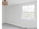 Bright bedroom with neutral walls, large window, and modern lighting, creating a serene atmosphere at 7154 S Hudson Cir, Centennial, CO 80122
