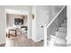Bright foyer features hardwood floors, white trim, and an adjacent dining area, creating an inviting entrance at 7154 S Hudson Cir, Centennial, CO 80122