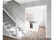 Inviting foyer with hardwood floors, staircase, and an adjacent dining room, creating a welcoming ambiance at 7154 S Hudson Cir, Centennial, CO 80122