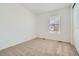 Bedroom with neutral carpeting and a bright window at 6634 N Malta St, Aurora, CO 80019