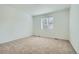 Carpeted bedroom featuring a bright window at 6634 N Malta St, Aurora, CO 80019