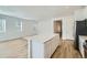 Spacious kitchen with a center island that opens to a bright living area, perfect for entertaining at 6634 N Malta St, Aurora, CO 80019