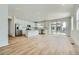 Open concept kitchen with stainless steel appliances, a center island, and large sliding doors at 6634 N Malta St, Aurora, CO 80019