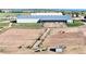 Aerial image displaying horse paddocks with horses and the stables, showcasing its horse-friendly amenities at 1705 Outter Marker Rd, Castle Rock, CO 80108