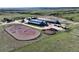 Aerial shot showcasing horse training facilities, barns, and pastures on the property at 1705 Outter Marker Rd, Castle Rock, CO 80108