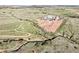 Captured from above, this image highlights the horse property's layout with paddocks, outbuildings, and expansive green spaces at 1705 Outter Marker Rd, Castle Rock, CO 80108