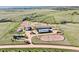 Aerial view of equestrian center with barns, training rings, and pastures at 1705 Outter Marker Rd, Castle Rock, CO 80108