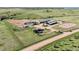 Aerial view of horse property with barns, house, paddocks, pastures, and open space at 1705 Outter Marker Rd, Castle Rock, CO 80108