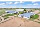 This aerial view presents the barns and paddocks, illustrating the horse property's layout and equestrian facilities at 1705 Outter Marker Rd, Castle Rock, CO 80108