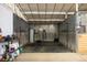Interior of a barn stall with rubber mats, painted walls, water heater, and 