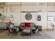 Inviting lounge area in the garage with comfortable seating, perfect for relaxation and social gatherings at 1705 Outter Marker Rd, Castle Rock, CO 80108