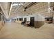 Well-organized horse barn with clean aisles, horse stalls, and dedicated seating area for caretakers at 1705 Outter Marker Rd, Castle Rock, CO 80108